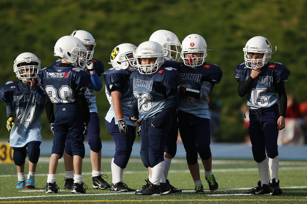 Youth American football players. Lift Your Game